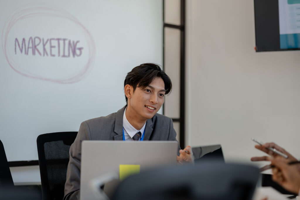 A young professional discussing strategy, showcasing real-world marketing jobs in action.