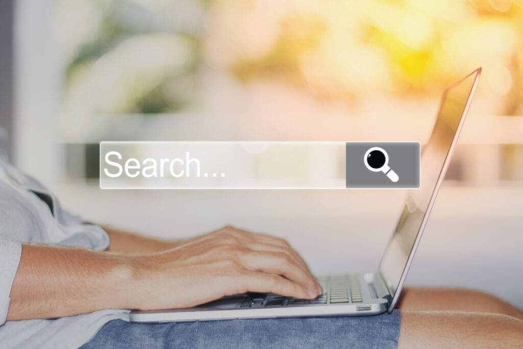 Person using a laptop to search